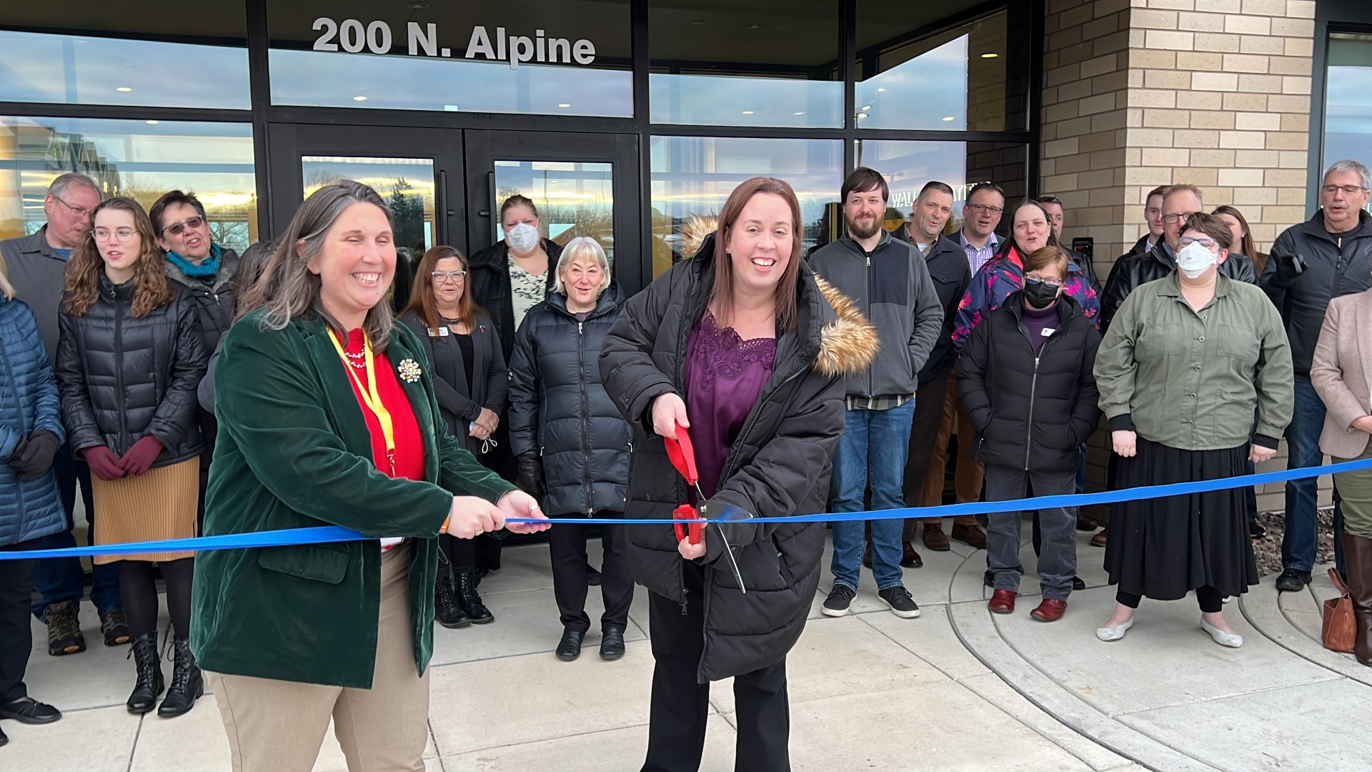 Director Jennifer Way cutting the ribbon