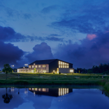 The exterior of the building at dusk
